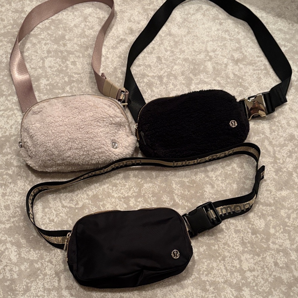 Lululemon 3 piece set belt bags.  1 Black & 1 cream fleece and one black nylon.